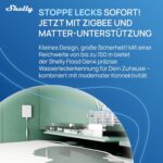 Shelly Flood Gen4 Wassersensor mit angeschlossenem Leck-Sensorkabel auf dem Boden