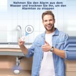 Zwei runde weisse Geevon Wassermelder mit Metallkontakten an der Unterseite
