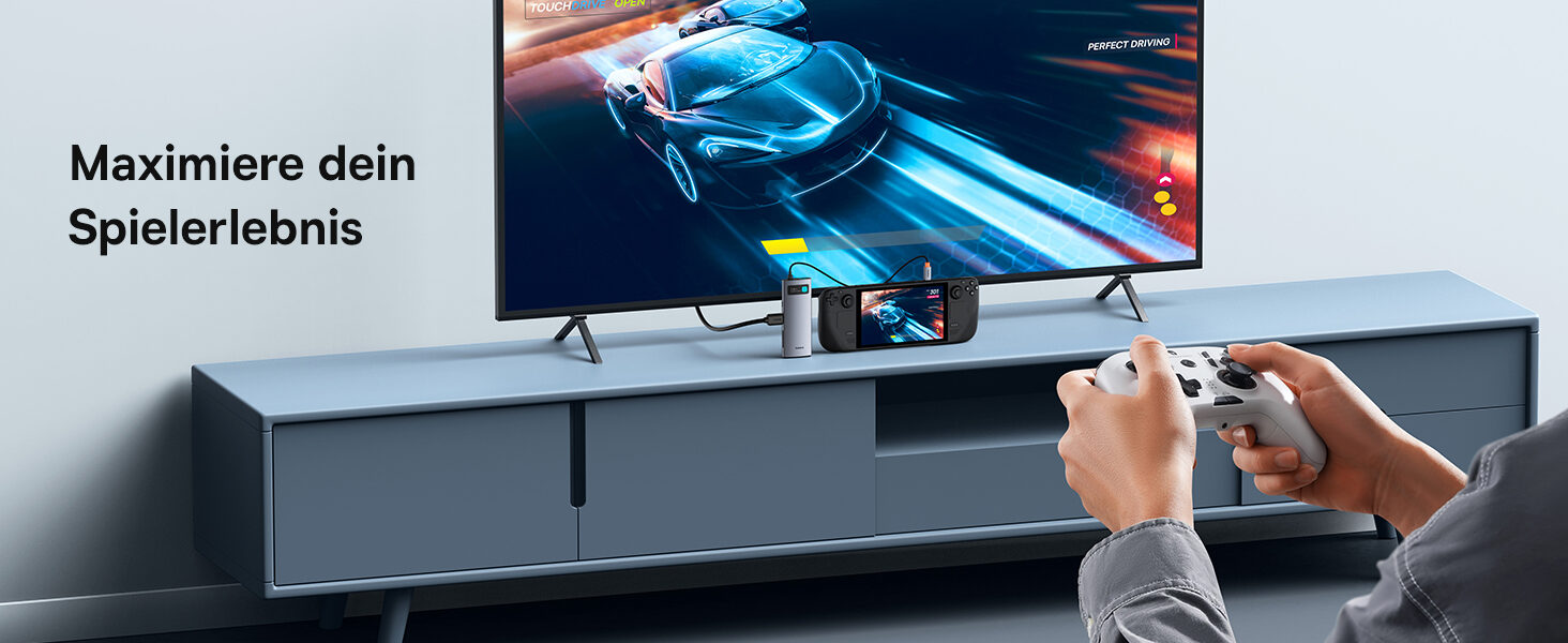 Handheld-Konsole ueber den Hub am Fernseher, Spieler mit Controller