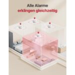 Weisser Rauchmelder X-Sense XS01-M neben der flachen quadratischen Basisstation SBS50 des Sets FS61.