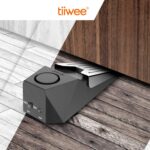 Zwei schwarze Alarm-Türstopper von tiiwee mit gebürsteter Oberseite und rundem Alarmschalter