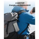 Schwarze A ADDTOP Solar-Powerbank mit ausklappbaren Solarpanels, USB-Anschlüssen und integrierter LED-Leuchte.